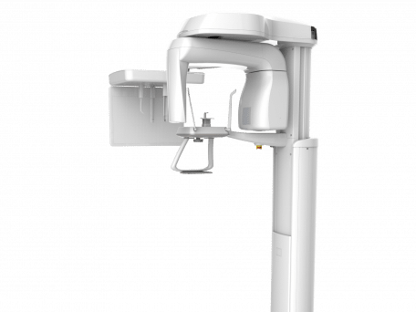 Panoramic dental X-ray machine positioned in clinical setting for patient imaging procedures.