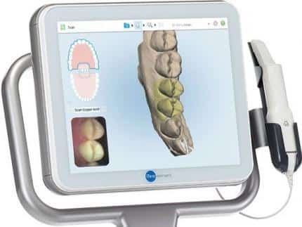 Dental imaging tablet displaying 3D scans of teeth and oral structures for patient examination.